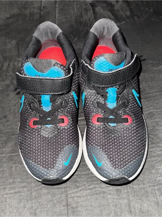 Renew Nike Kids size 13. Running Black Sneakers with Blue and neon pink .