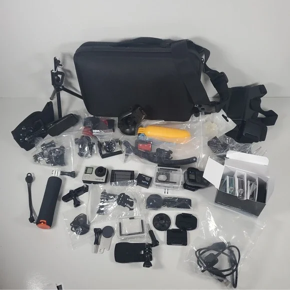 GoPro Hero4, Two Batteries, And Accessories Lot. Mounts, Body And Head Harness