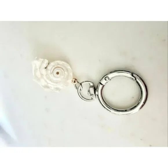 Pearlescent with silver color seashell keychain