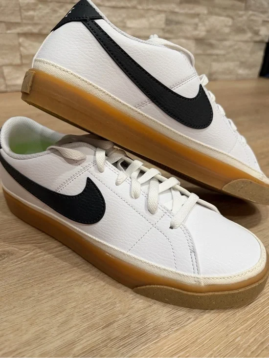 Nike Women's White Sneakers with Black Swoosh and Gum Sole