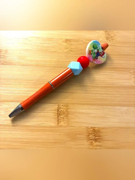 Character Themed Orange Beaded Pen with Blue and Red Accents