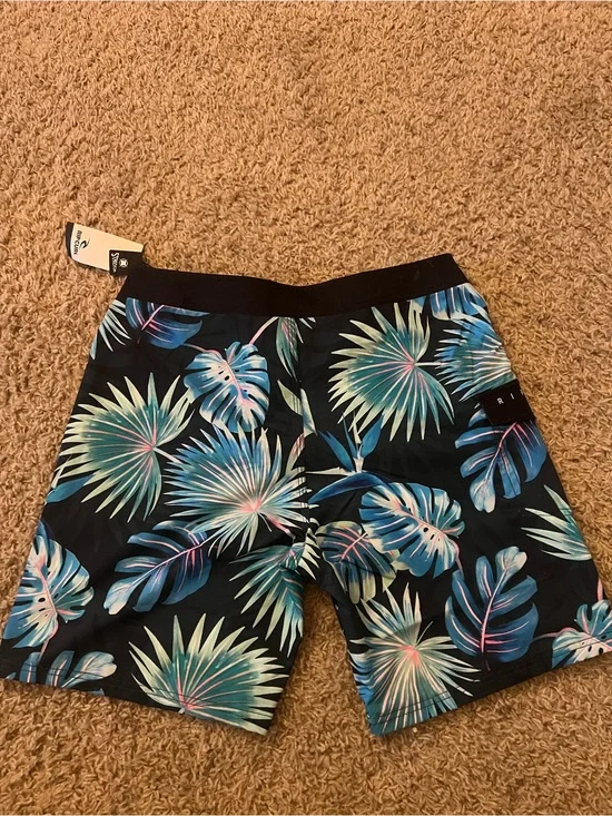 Rip Curl Black Swim Shorts with Blue-Green Tropical Leaves