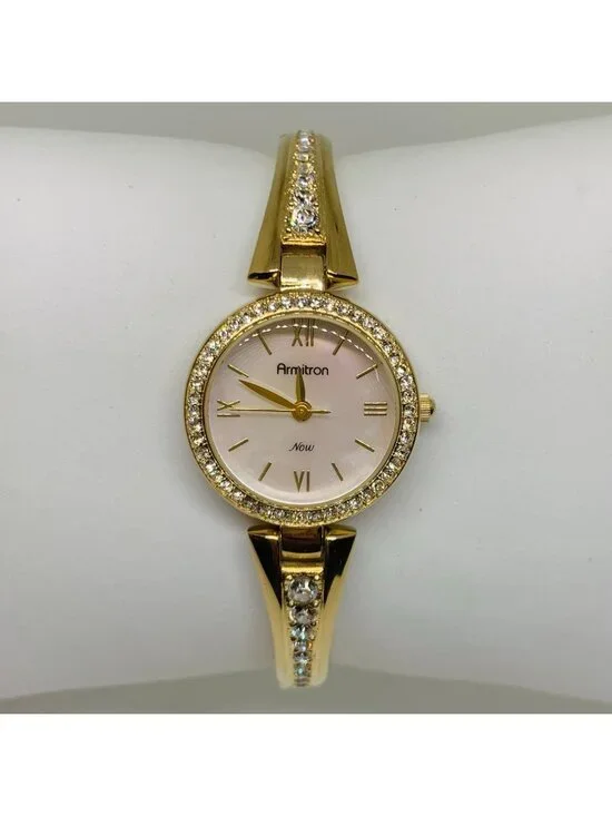 Armitron women’s watch gold tone 24mm mop dial quartz rhinestones running