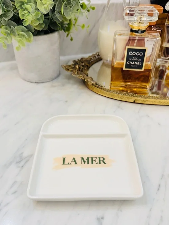 La Mer White Porcelain Trinket Tray with Green Logo and Beige Accent