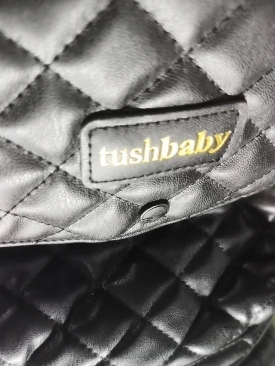 a MINT Tushbaby Quilted Vegan Black Leather Bag. Excellent.