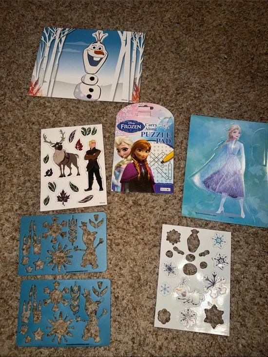 Disney Frozen themed activities, including a puzzle pad/magnets/stencils