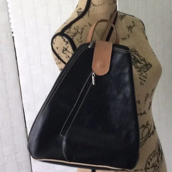 Woman’s Bag Style by Vera Pelle Shoulder Strap zips to convert to a Backpack.