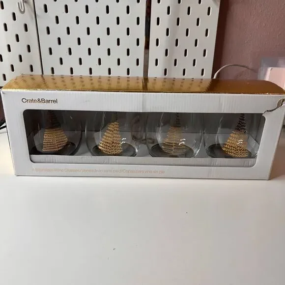 Crate & Barrel boxed set of 4 stemless wine glasses featuring a holiday tree des