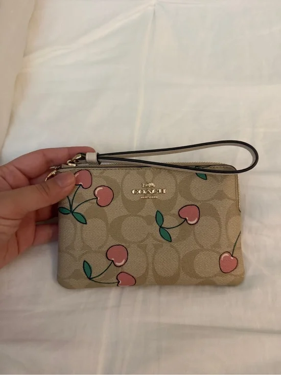 Coach corner zip wristlet with pink cherry print