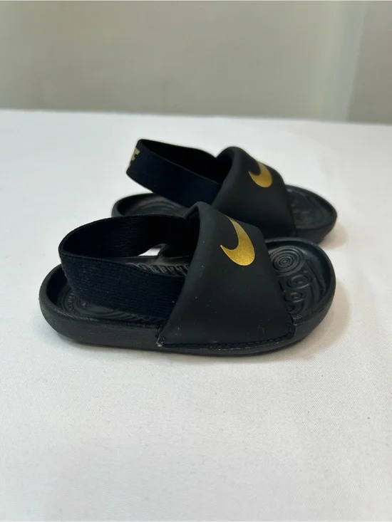 Nike Kids Black Slides with Gold Swoosh and Elastic Heel