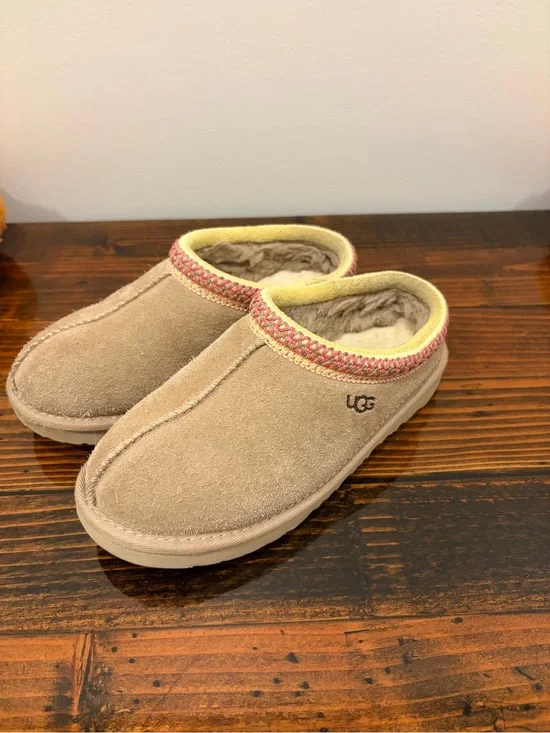UGG Kids Slip-On Suede Slippers in Tan with Pink Trim