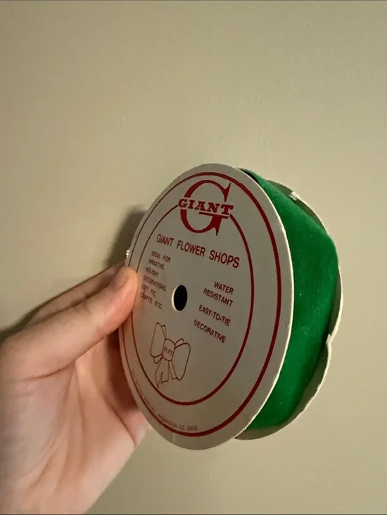vintage spool of green floral and craft ribbon distributed by Giant - used