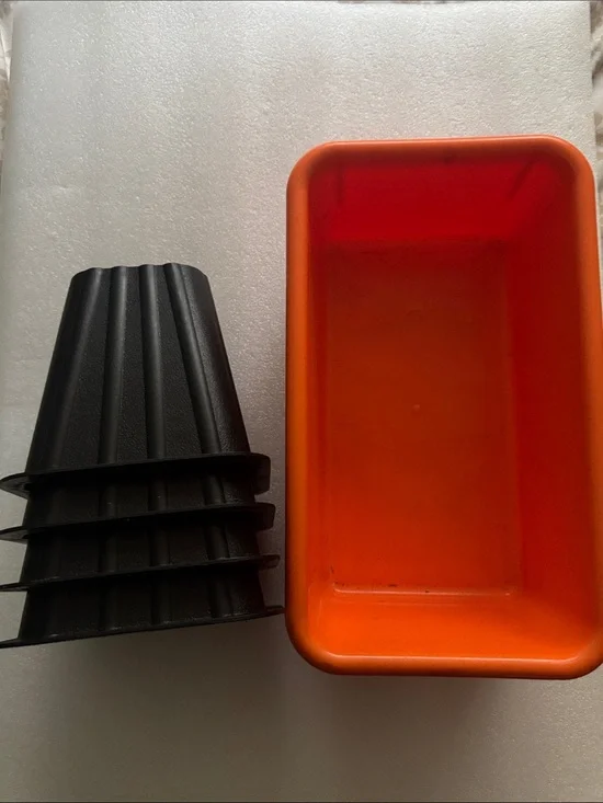 Bed risers and orange bin/ Container