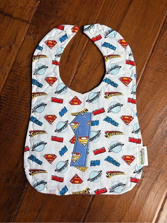DC Comics Superman White Bib with Blue and Red Accents