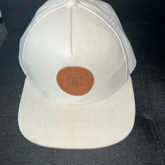 Kids off white colored DV shoes snap back hat some signs of wear see pics.