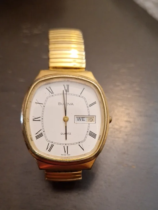 Bulova Gold and White Dress Watch with Roman Numerals‎