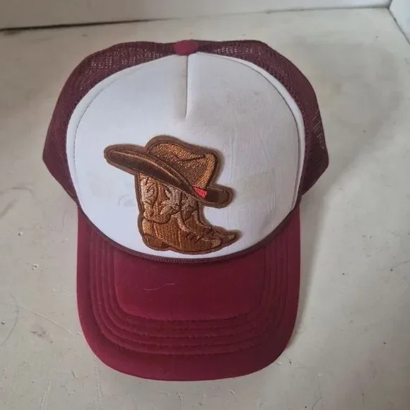 Red polyester mesh trucker hat with cowboy hat/boots iron on