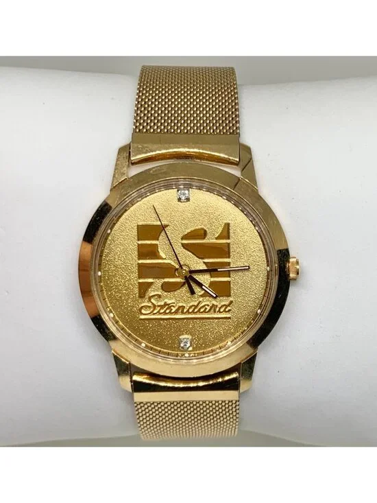 Vintage Jostens Swiss made men’s quartz watch standard 35mm gold tone running