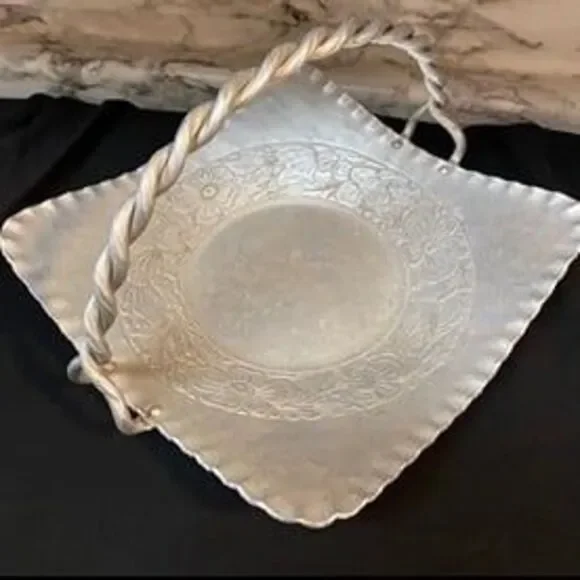 * hand-forged hammered aluminum basket engraved floral bouquet twisted handle