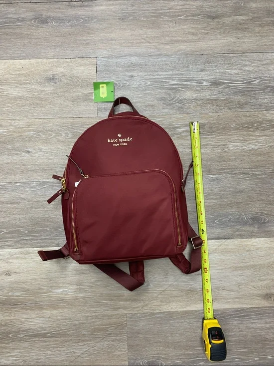 kate spade burgundy nylon backpack with gold-tone accents