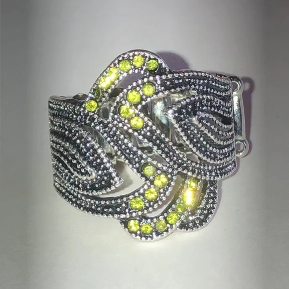 Silver Tone Ring with Green Crystal Accents