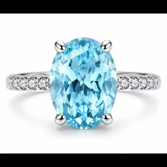 Sterling Silver Oval Blue Topaz Ring with Pavé Accents