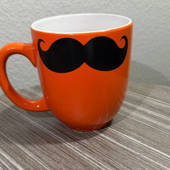 Orange Mug with Black Mustache Design