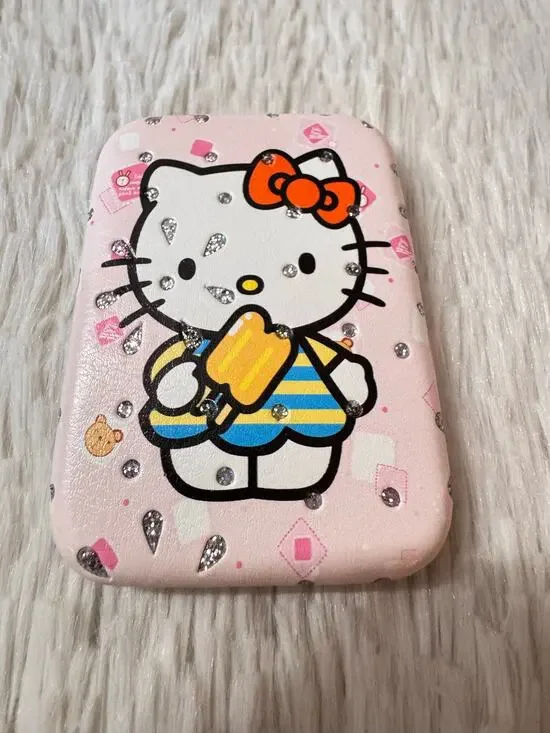 Hello Kitty compact mirror doble side with Hello Kitty holding a popsicle