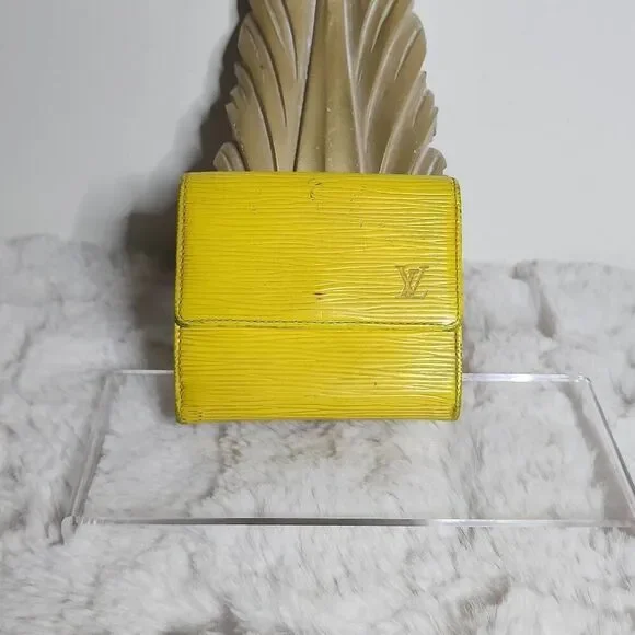 Louis Vuitton Elise Trifold Wallet crafted from their signature Tassil Yellow Ep