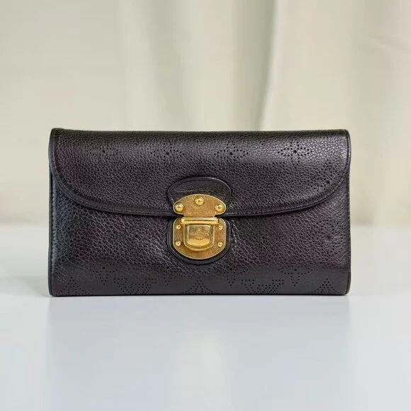 Louis Vuitton Black Monogram Canvas Wallet with Gold Hinge Detail Elegant Design
