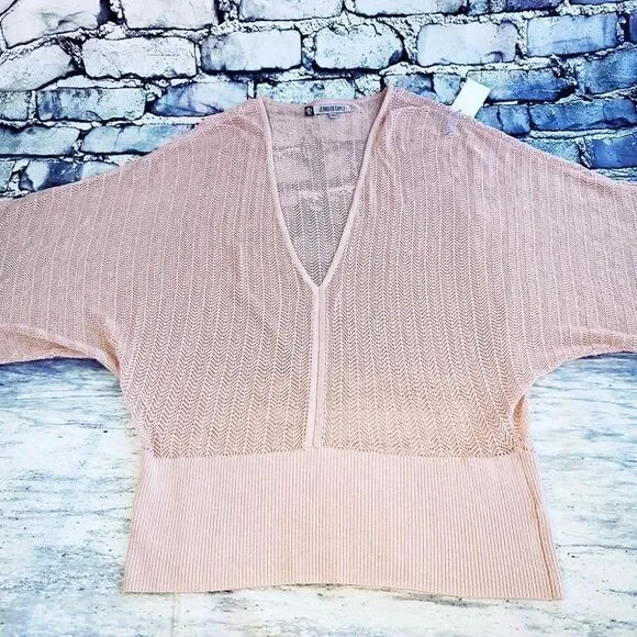 Jennifer Lopez pink peekaboo crochet silver thread kimono sleeves