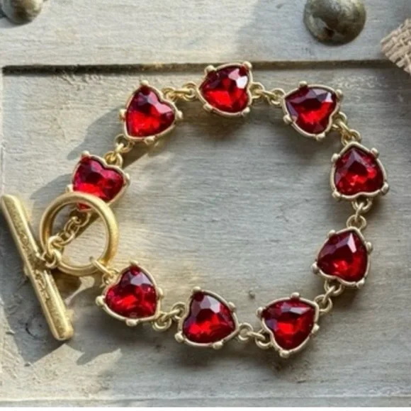 Elegant Gold and Red Heart Bracelet from Oscar de la Renta