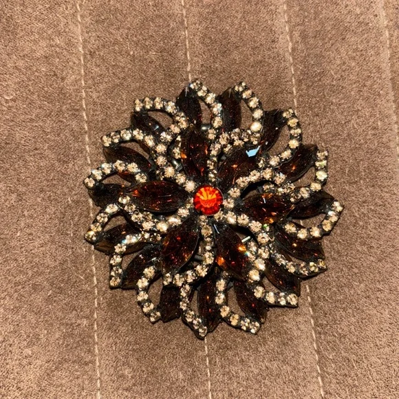 Beautiful brown stone with yellow stone detailing.Red-orange center stone brooch