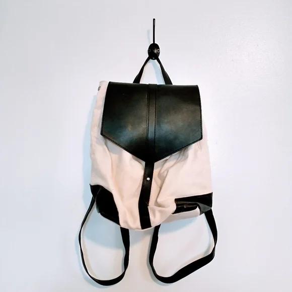 Deux Lux beige and black faux leather mini bag with buttons on the side to expan