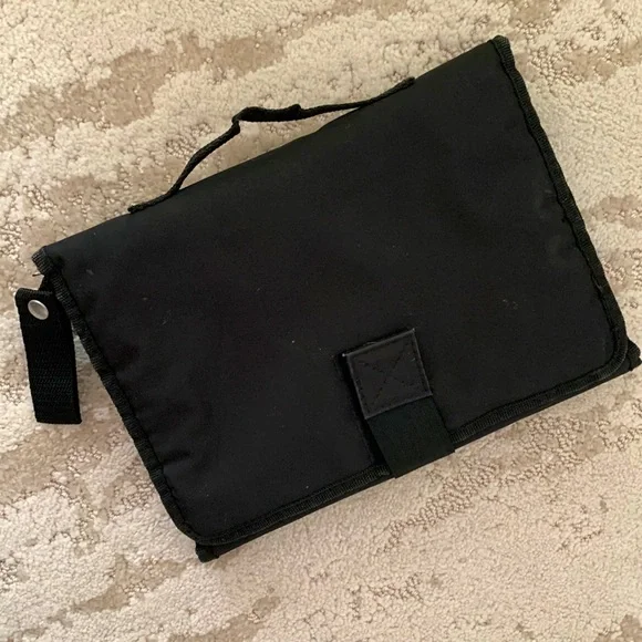 Black travel diaper changer - netting pockets, carry handle