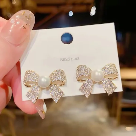 Gold and White Bow Stud Earrings with Sparkling Stones