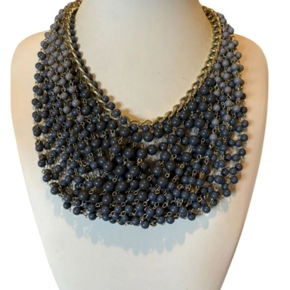 Gold plated cuban link chain with dangling graduated color jasper roundbeads