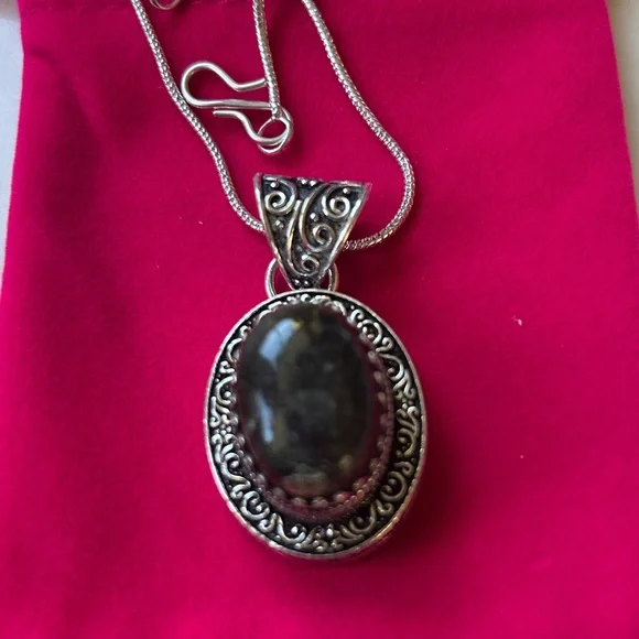 Vintage‎ dark brown black agate pendant with a sterling silver setting.