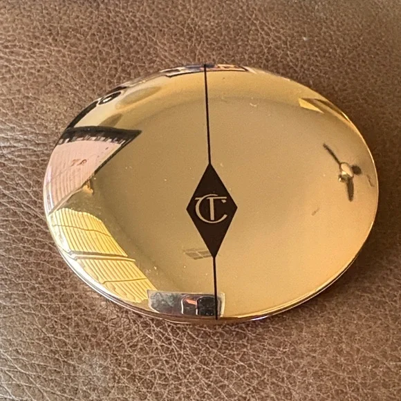 Charlotte Tilbury Shiny Gold Oval Compact with CT Emblem