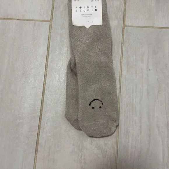 NWT fuzzy smiley pointe studio grip socks. Size small