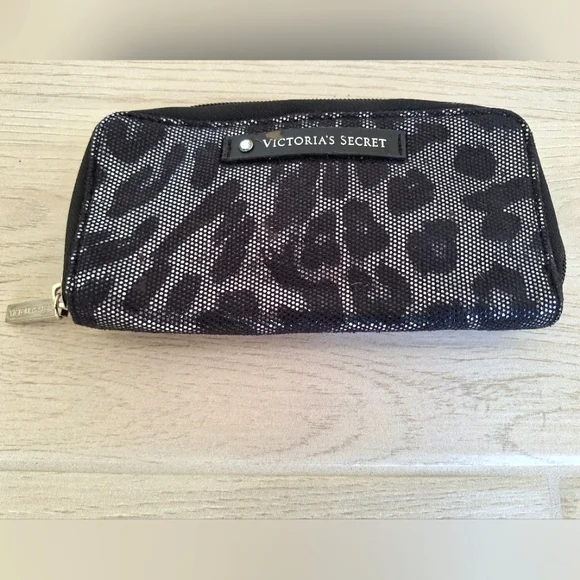 Victoria's Secret makeup brushes in a black and silver zipper makeup bag