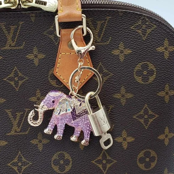 Authentic Louis Vuitton Lock & Key with unbranded Elephant Bagcharm, Keycharm