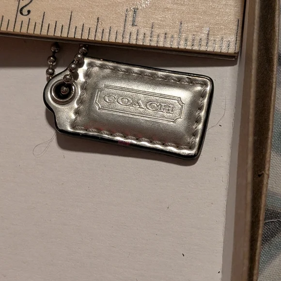 Coach‎ Mettalic Silver Small Leather Hang Tag With Silver Chain