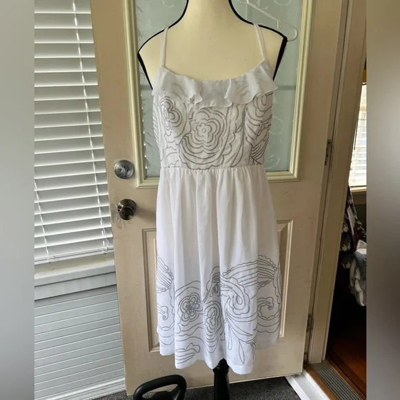 Johnny Martin size L white and silver floral Sequined dress. Racer back ruffled