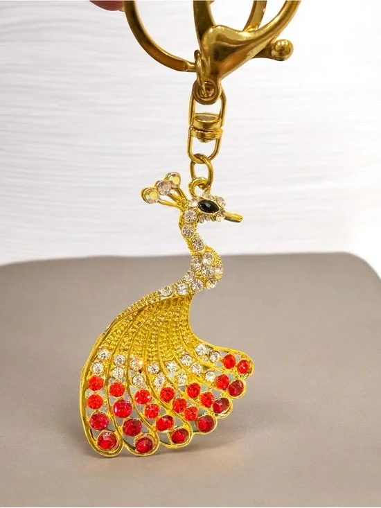 Peacock Keychain Charm with Red Crystal Accents in gold tone nwot