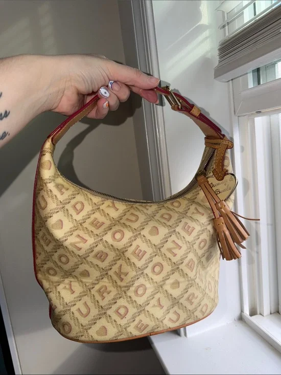 Dooney & Bourke vintage YTK Beige Canvas Hobo with Red Trim and Tan Tassel