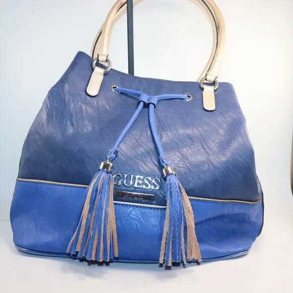 Guess PU drawstring bucket bag with‎ tassels