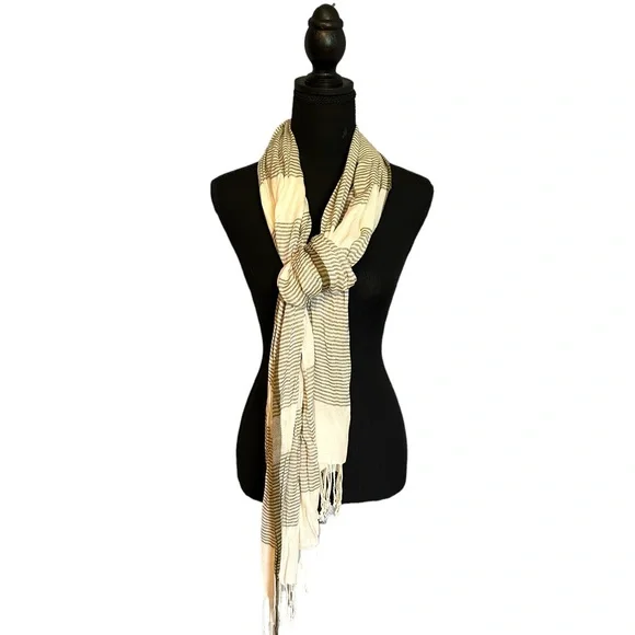 Cream and olive scarf. Fringe detail on the end.