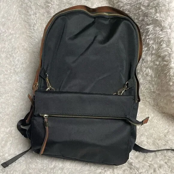 Tommy Bahama Black Laptop Case Backpack With Brown trims and straps .