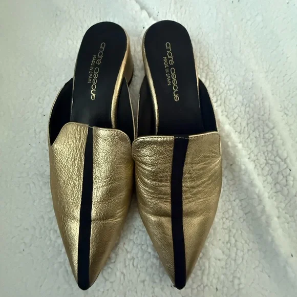 Andre Assoues gold and black slip on pointy style